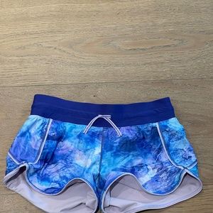 Colorful purple/blue kids athletic shorts made by Ivivva